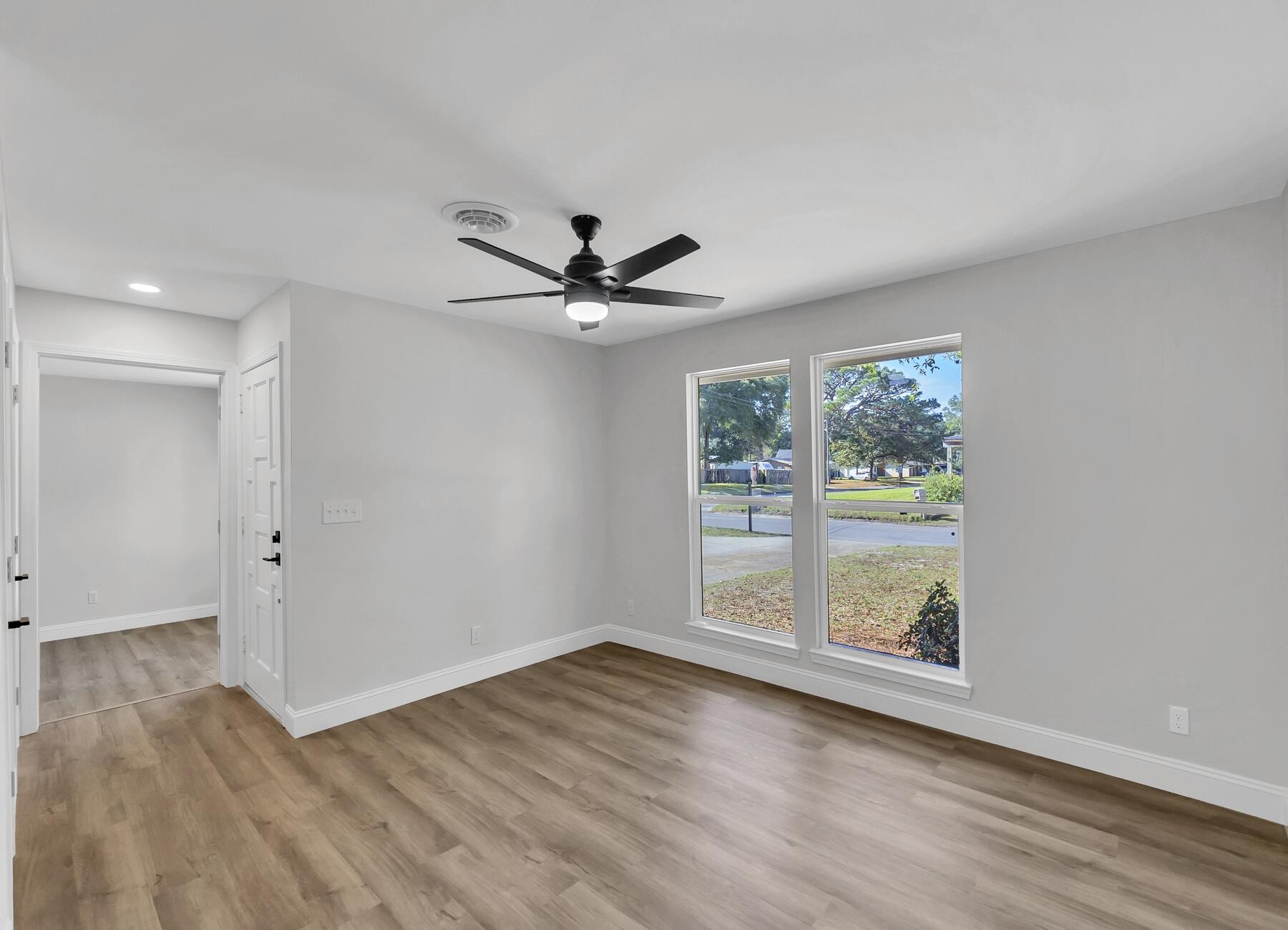 500 Ross Road Fort Walton Beach, FL 32547 - Photo 8 of 38 wooden floor in an empty room with a window