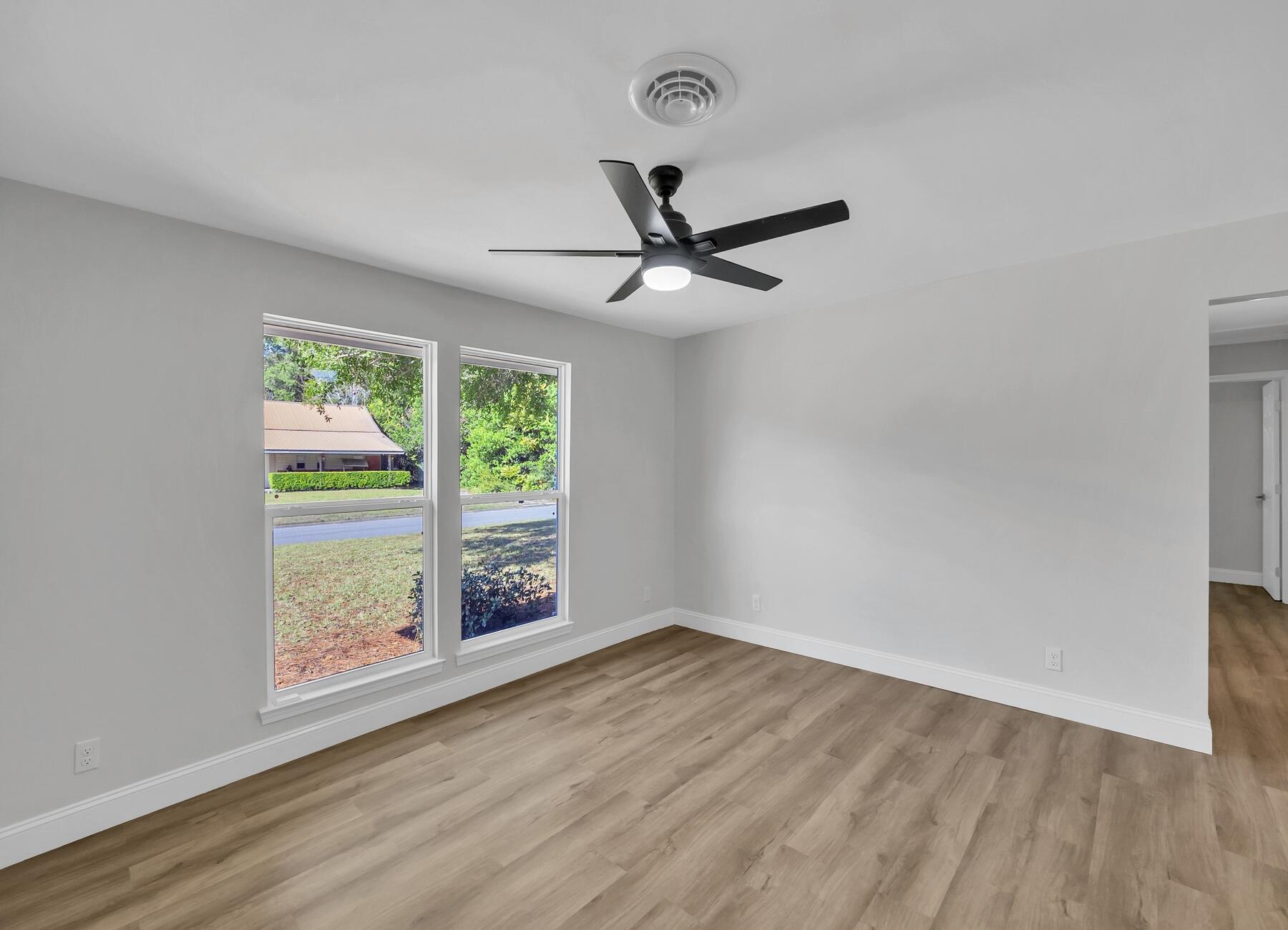 500 Ross Road Fort Walton Beach, FL 32547 - Photo 9 of 38 wooden floor in an empty room with a window