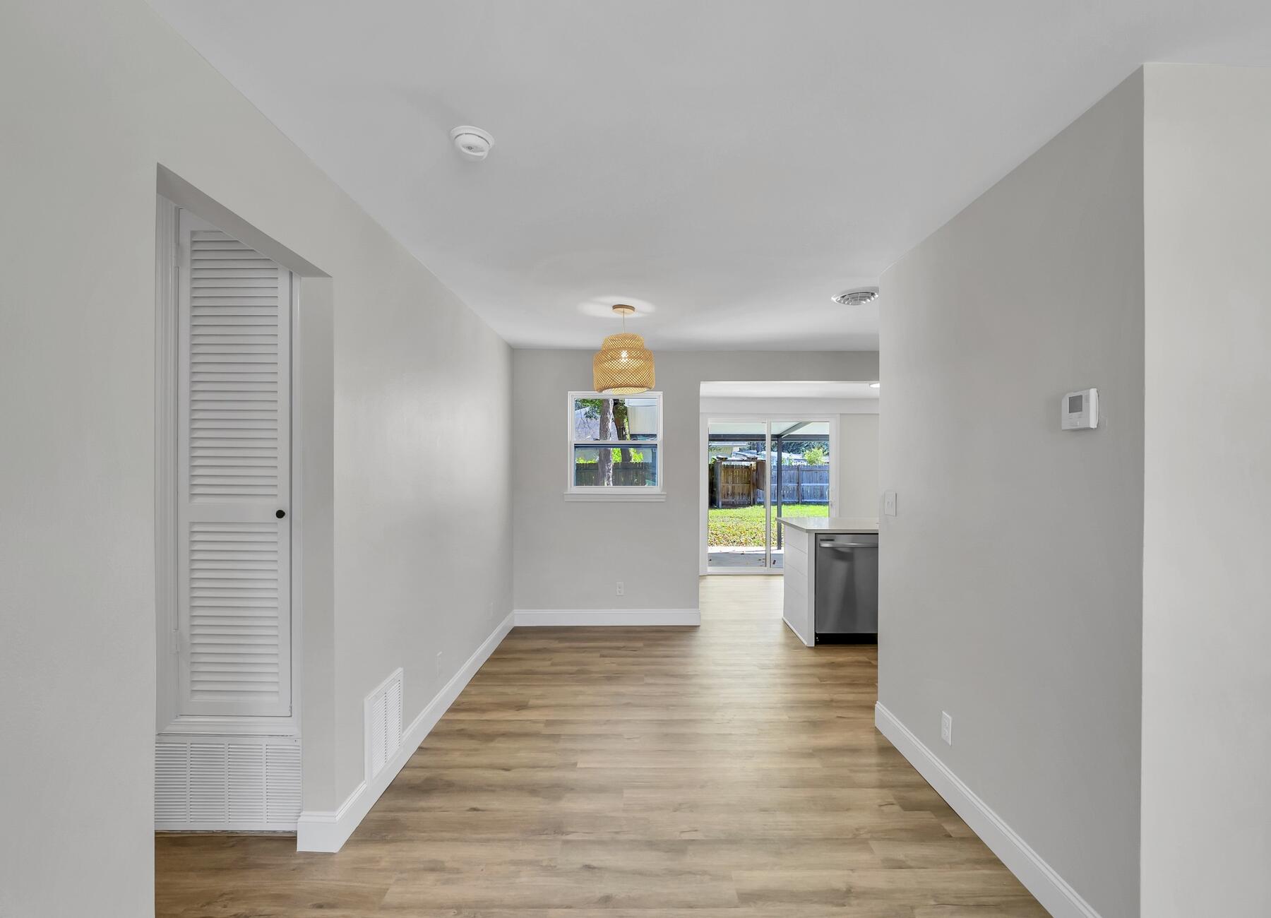 500 Ross Road Fort Walton Beach, FL 32547 - Photo 10 of 38 a view of empty room with wooden floor and stove