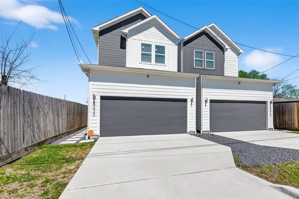 a front view of a house with yard