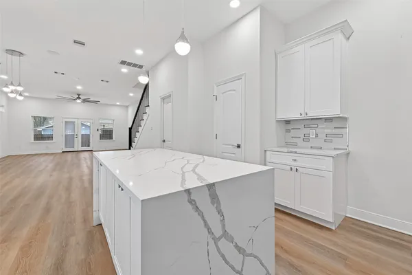 a view of cabinets with wooden floor