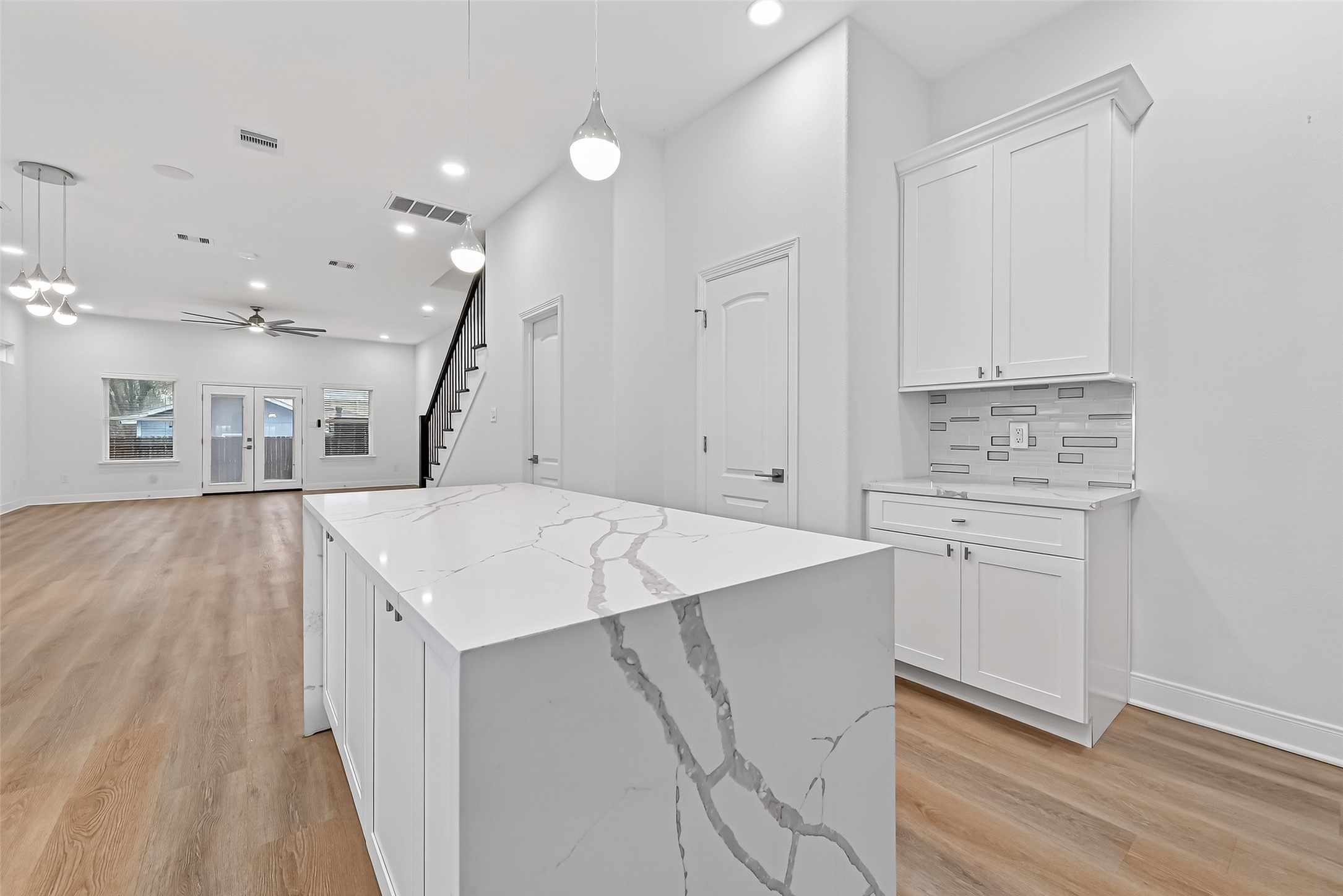 6630 Highrock Road Houston, TX 77092 - Photo 14 of 40 a view of cabinets with wooden floor