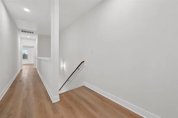 a view of a hallway with staircase