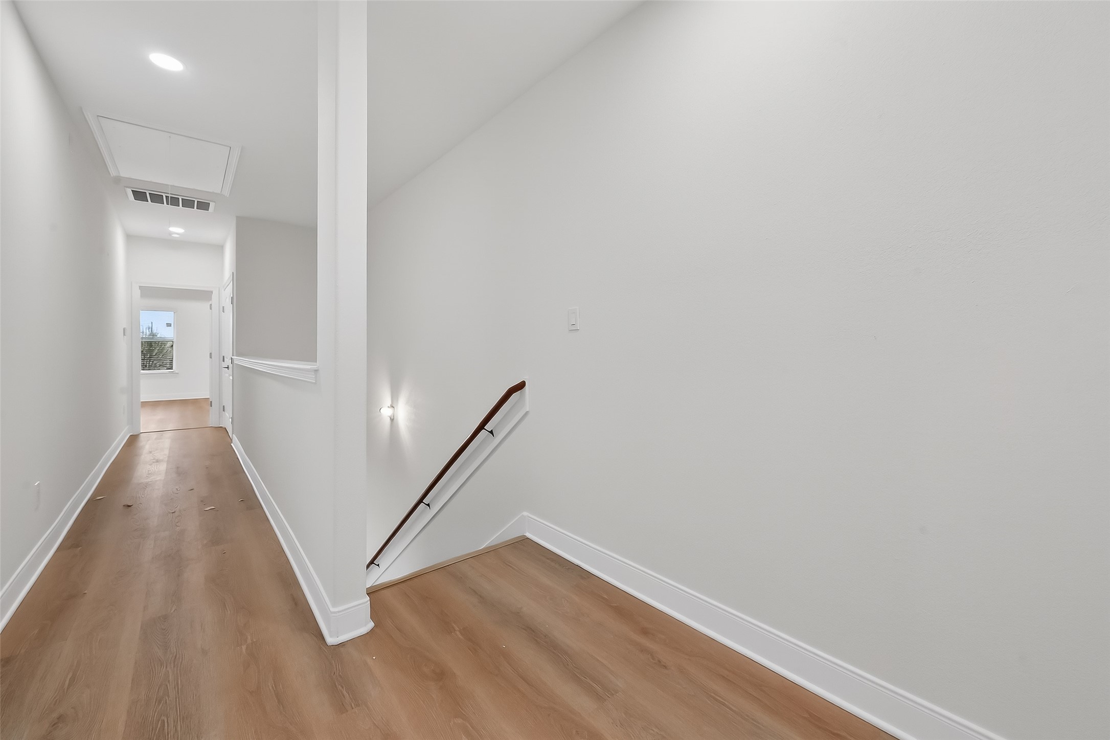 6630 Highrock Road Houston, TX 77092 - Photo 19 of 40 a view of a hallway with staircase