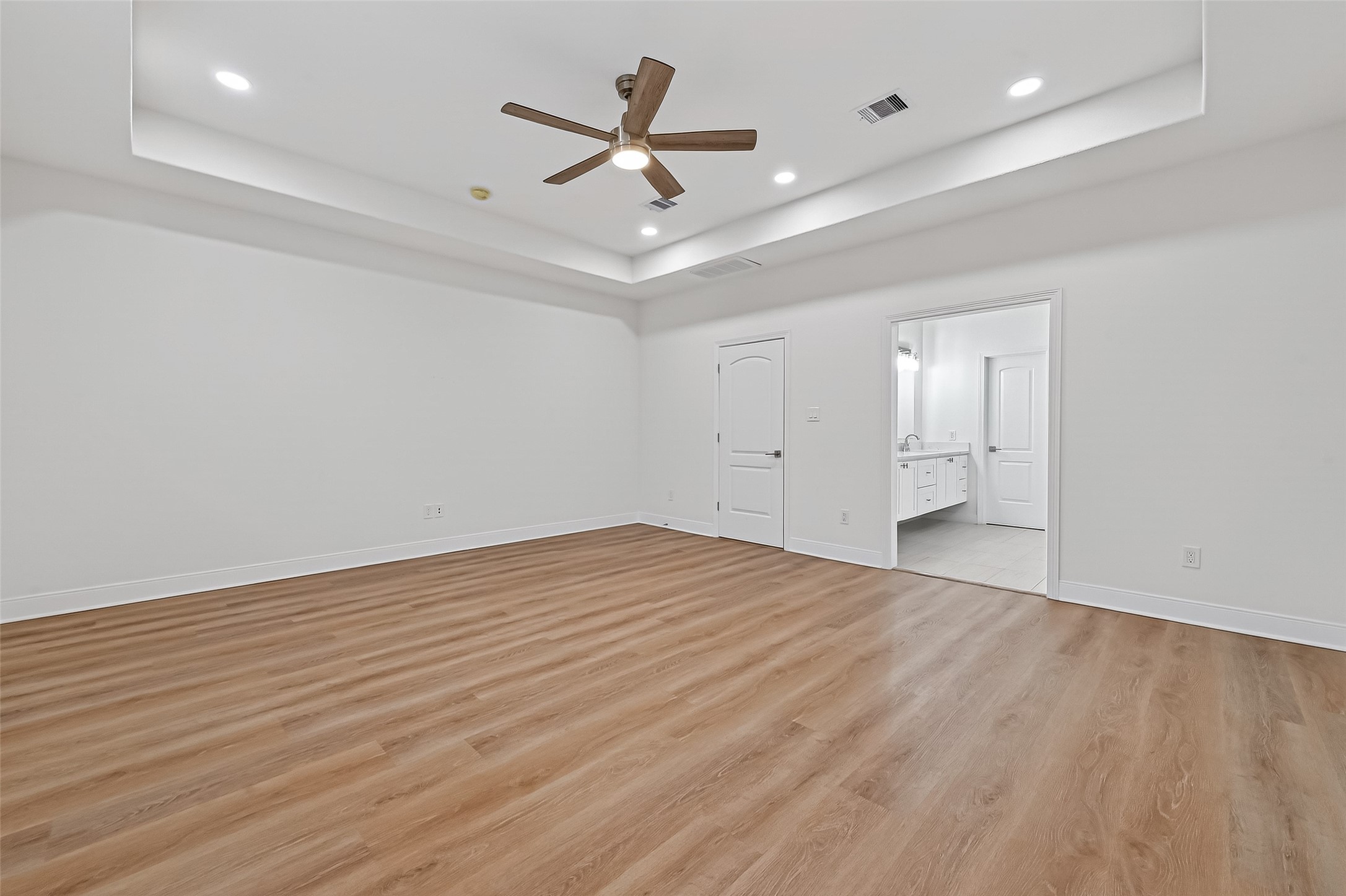 6630 Highrock Road Houston, TX 77092 - Photo 21 of 40 a view of empty room with wooden floor