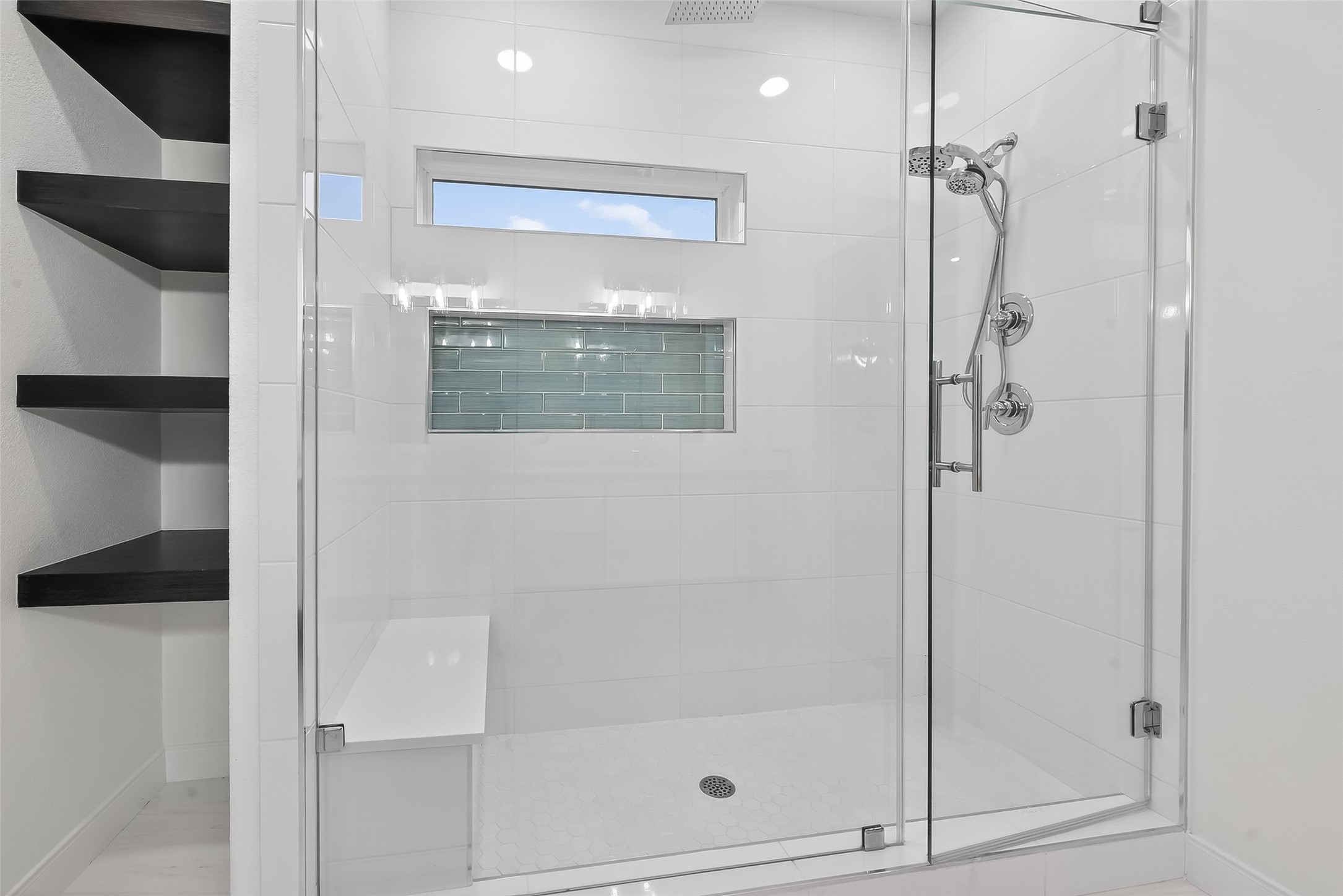 6630 Highrock Road Houston, TX 77092 - Photo 24 of 40 a bathroom with a glass shower door