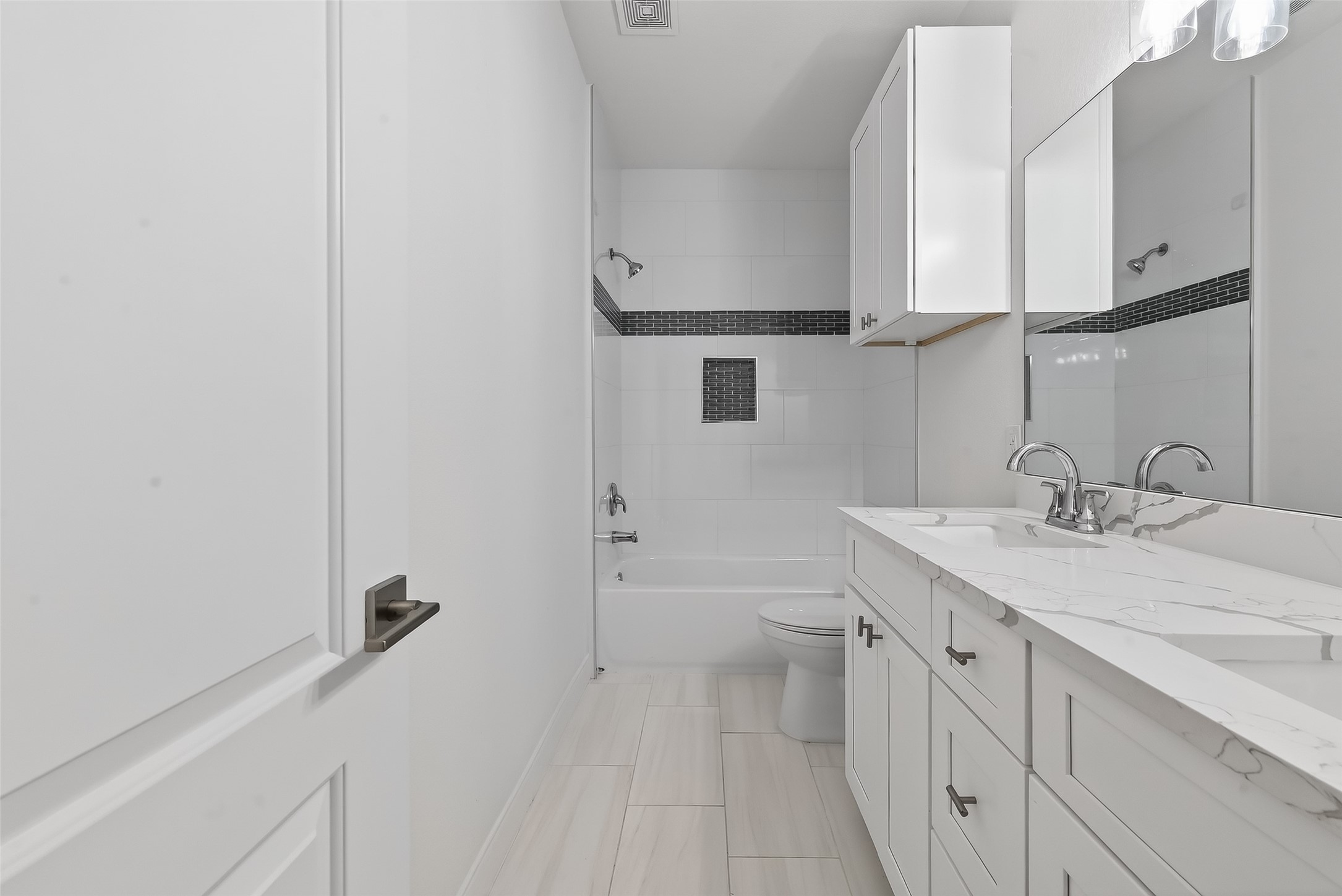 6630 Highrock Road Houston, TX 77092 - Photo 30 of 40 a bathroom with a sink a toilet and vanity