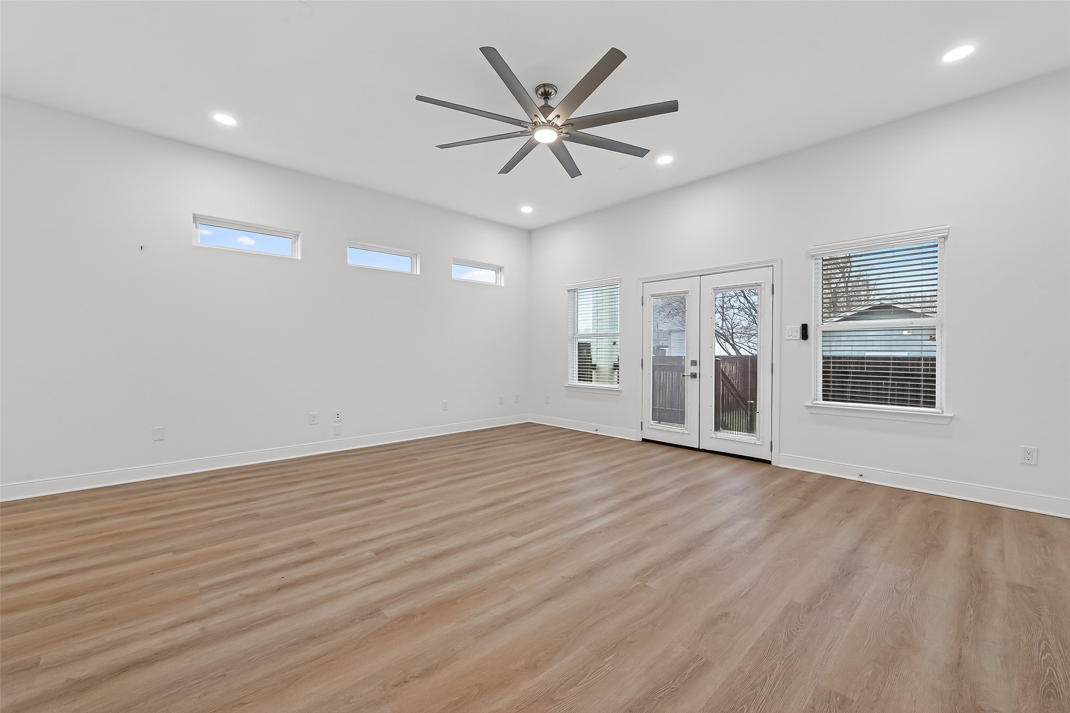 6630 Highrock Road Houston, TX 77092 - Photo 4 of 40 wooden floor in an empty room with a window