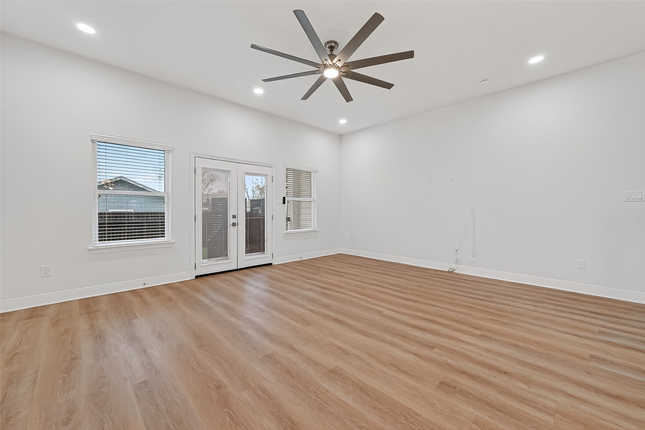 6630 Highrock Road Houston, TX 77092 - Photo 5 of 40 wooden floor in an empty room with a window
