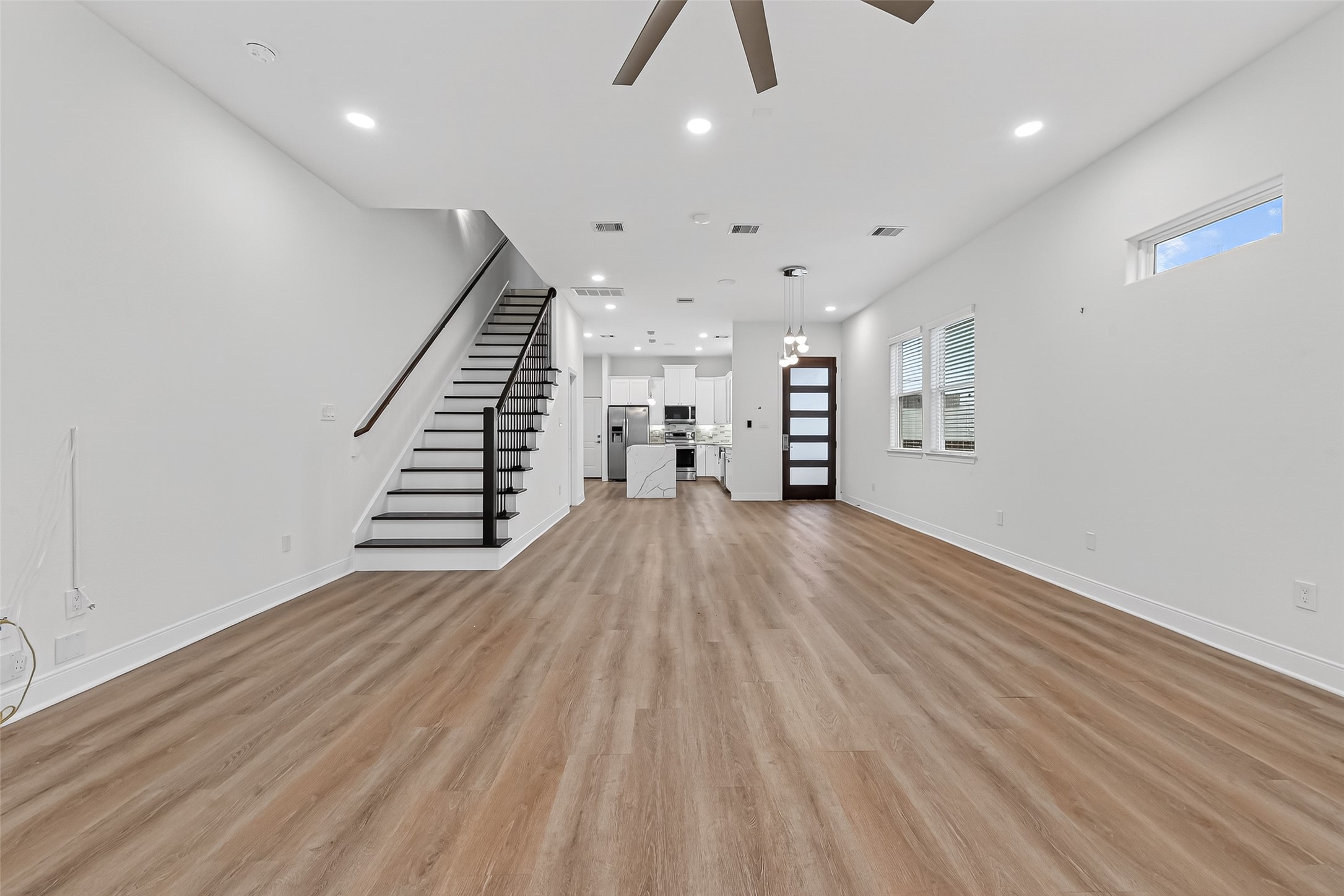 6630 Highrock Road Houston, TX 77092 - Photo 8 of 40 a view of empty room with wooden floor