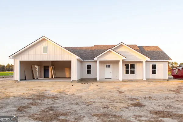 a front view of a house with yard