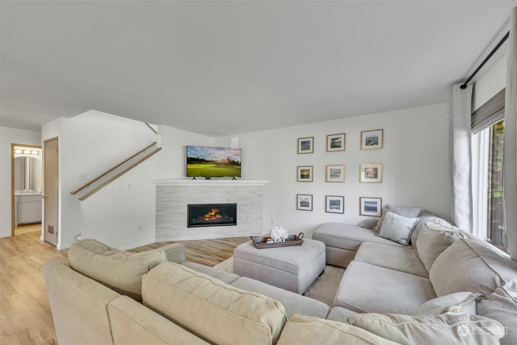 17427 92nd Avenue Northeast Bothell, WA 98011 - Photo 11 of 35 a living room with furniture and a fireplace