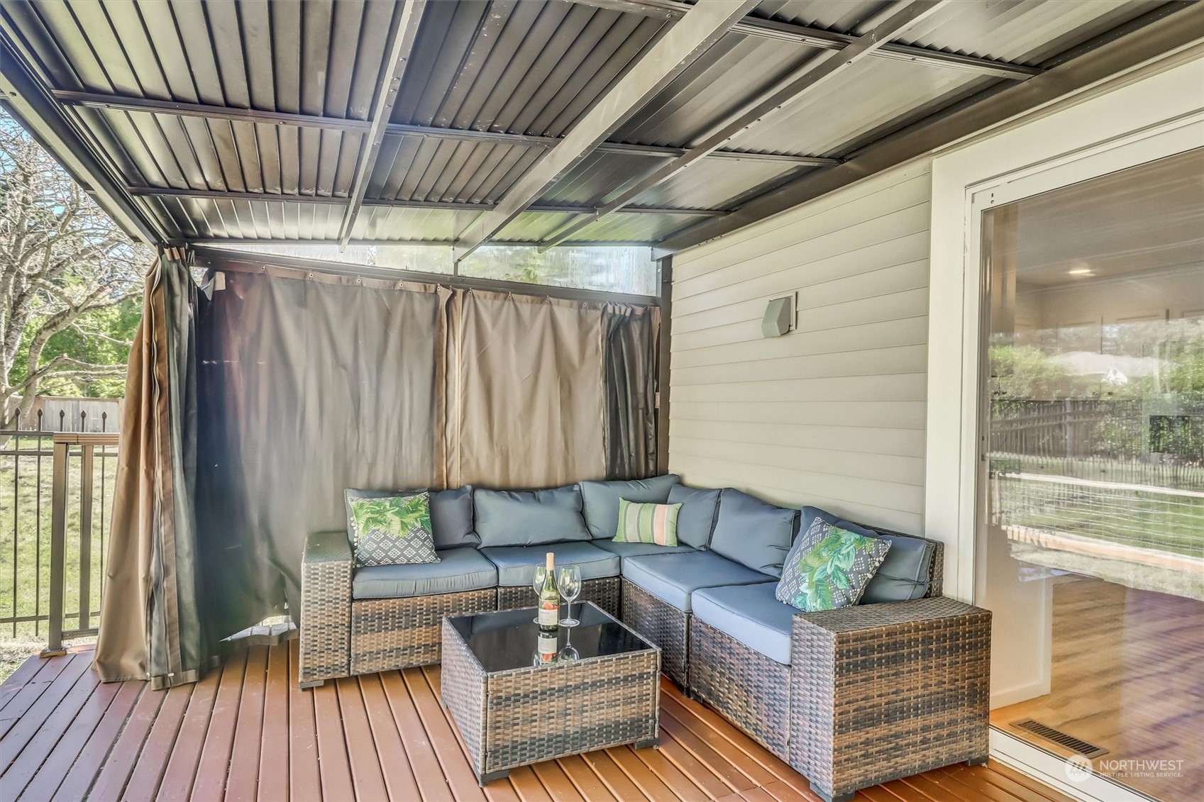 17427 92nd Avenue Northeast Bothell, WA 98011 - Photo 15 of 35 a outdoor living space with patio furniture and wooden floor