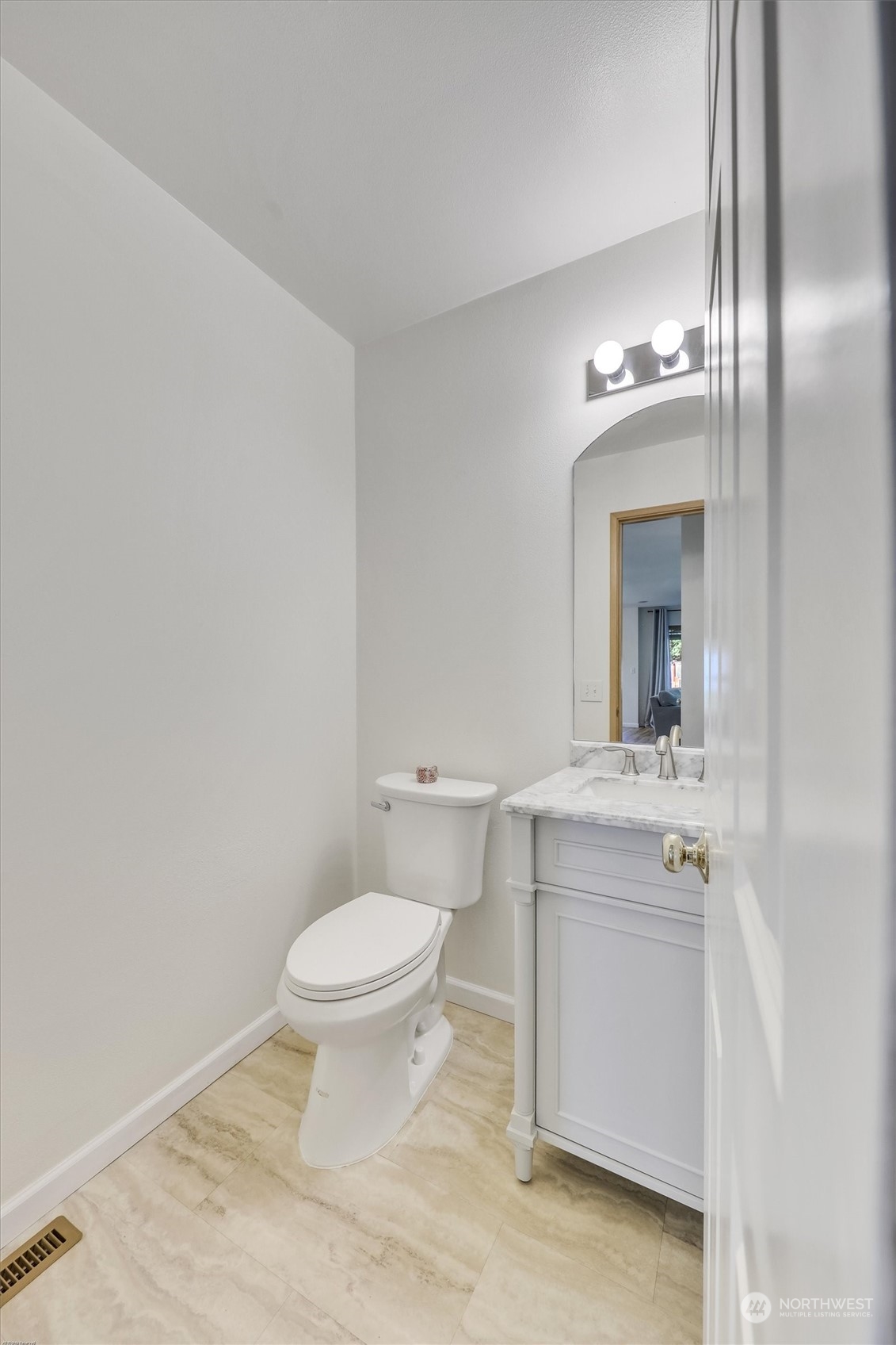 17427 92nd Avenue Northeast Bothell, WA 98011 - Photo 19 of 35 a bathroom with a granite countertop toilet a sink and a mirror
