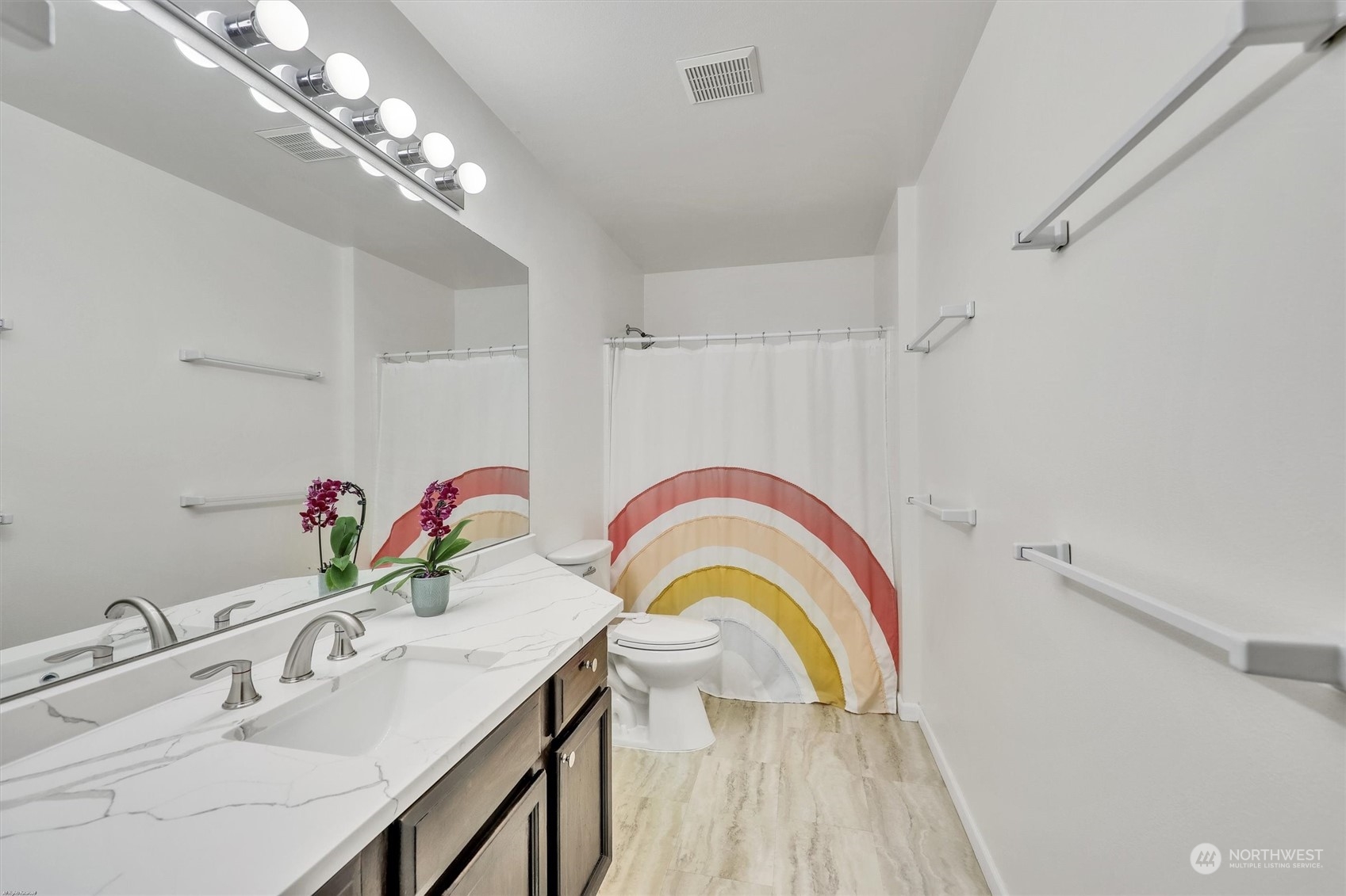 17427 92nd Avenue Northeast Bothell, WA 98011 - Photo 24 of 35 a bathroom with a sink a vanity and a mirror