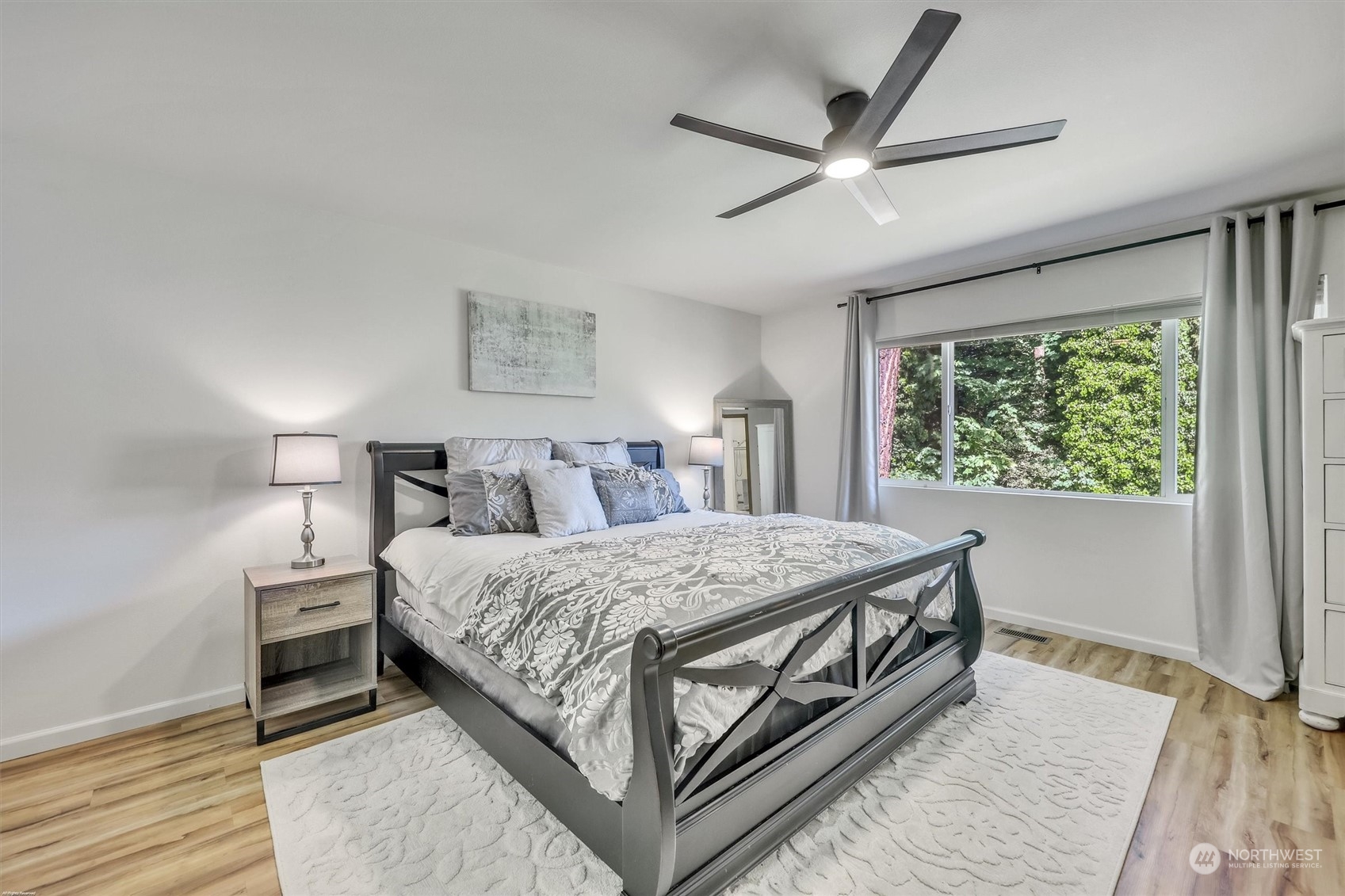 17427 92nd Avenue Northeast Bothell, WA 98011 - Photo 25 of 35 a bedroom with a bed and a large window