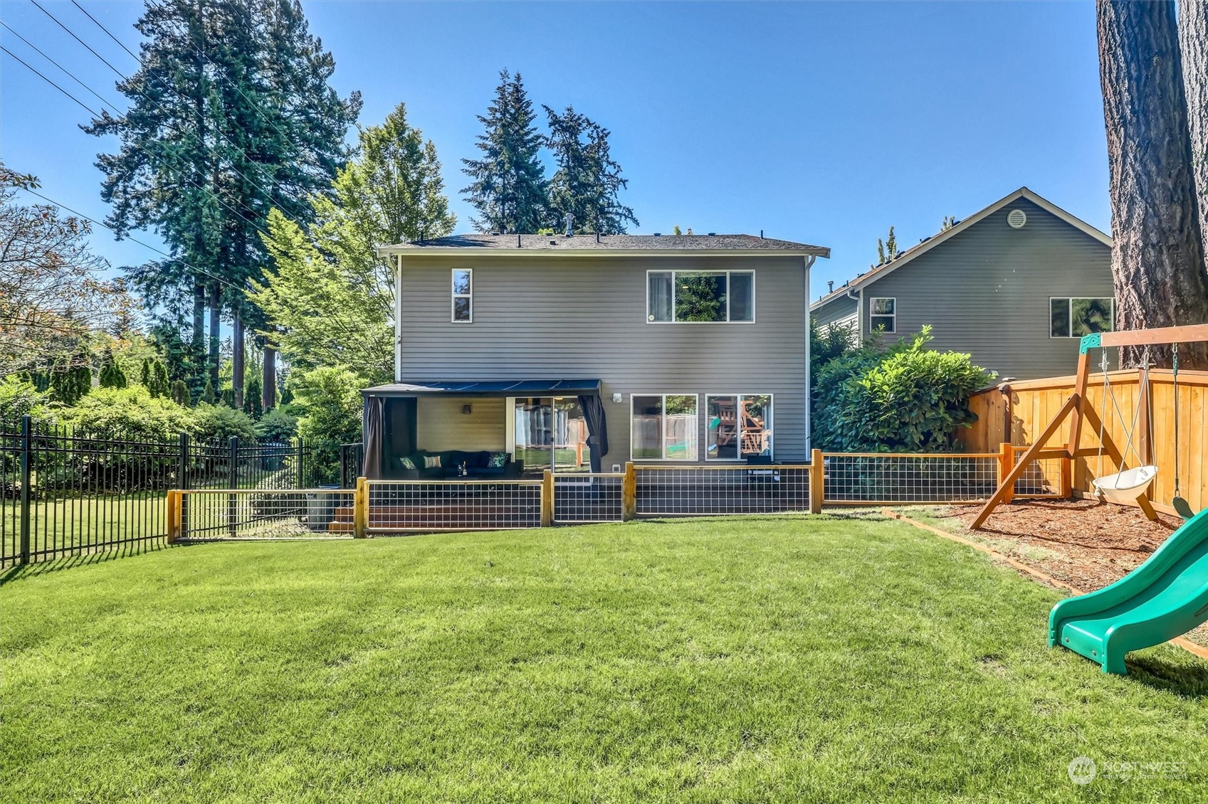 17427 92nd Avenue Northeast Bothell, WA 98011 - Photo 30 of 35 a view of a house with a backyard and a patio