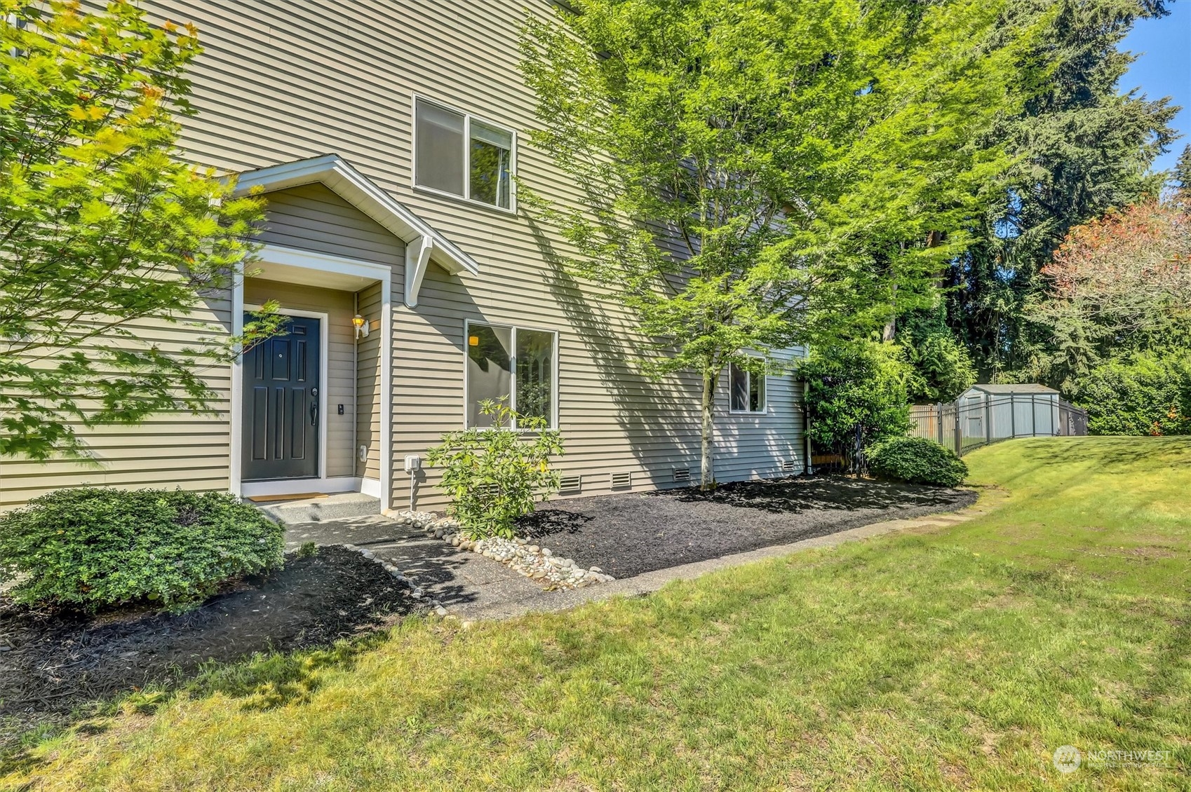 17427 92nd Avenue Northeast Bothell, WA 98011 - Photo 3 of 35 a view of a house with a small yard and plants