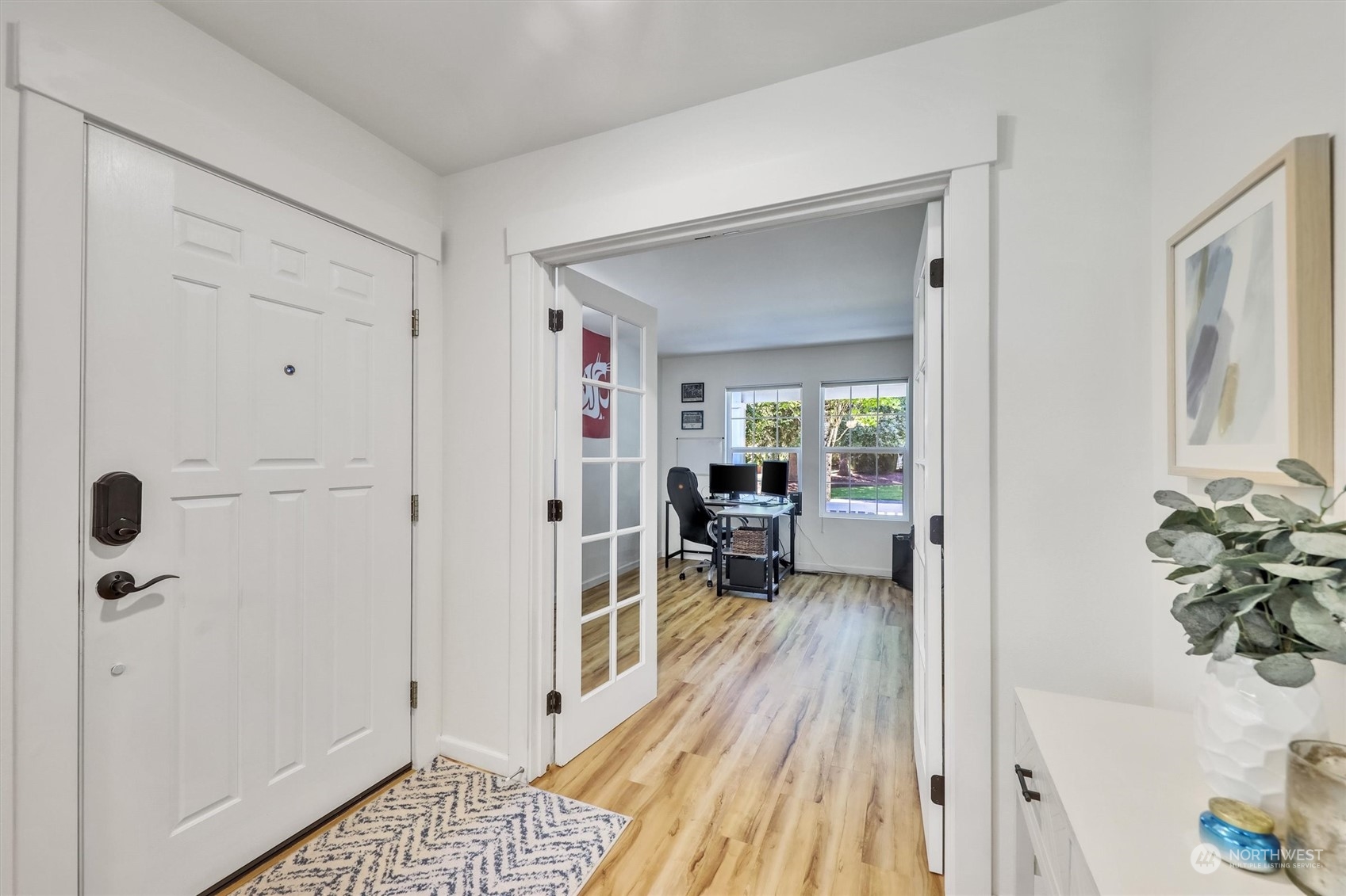 17427 92nd Avenue Northeast Bothell, WA 98011 - Photo 4 of 35 a view of a bedroom with a bed and wooden floor