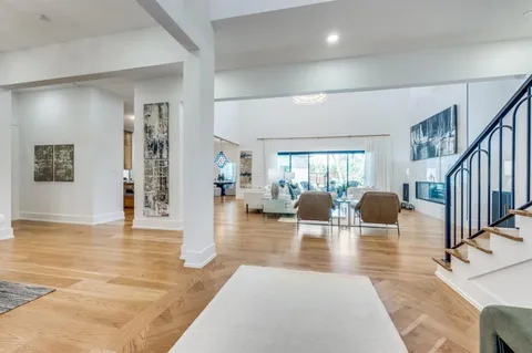 a view of livingroom with dining room and wooden floor