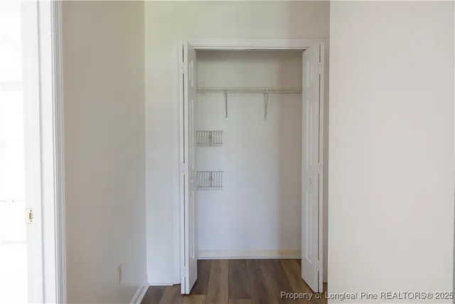 a view of front door with wooden floor