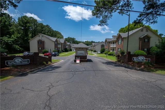 a small garden covered with tall buildings