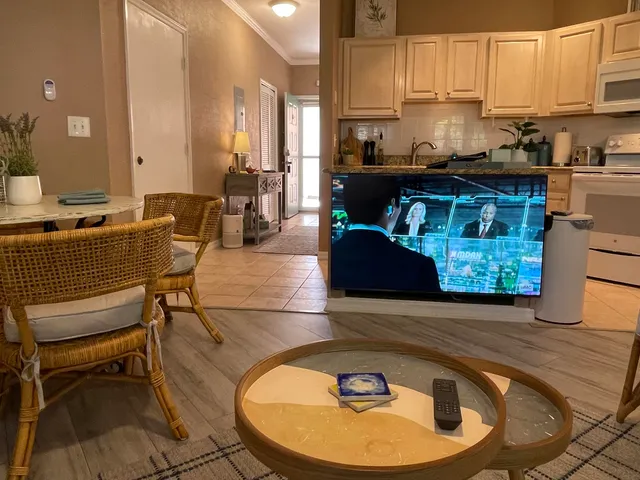a kitchen with a sink appliances and cabinets