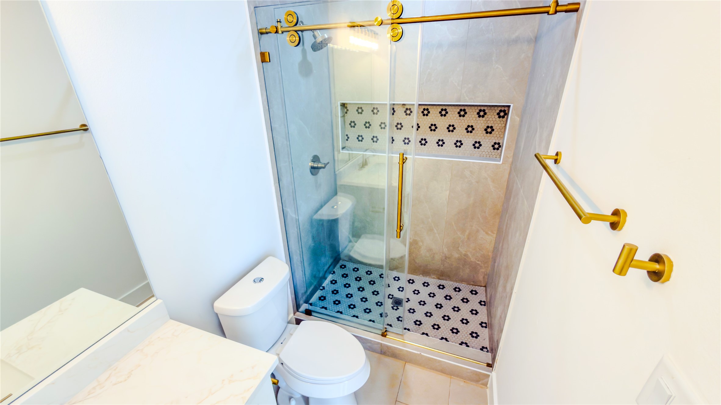 823 North Loop Houston, TX 77022 - Photo 16 of 23 a bathroom with a toilet and a shower