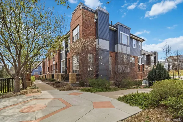 a view of a brick house with large windows