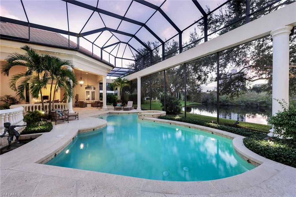 7261 Tilden Lane Naples, FL 34108 - Photo 2 of 46 a view of a swimming pool with a patio