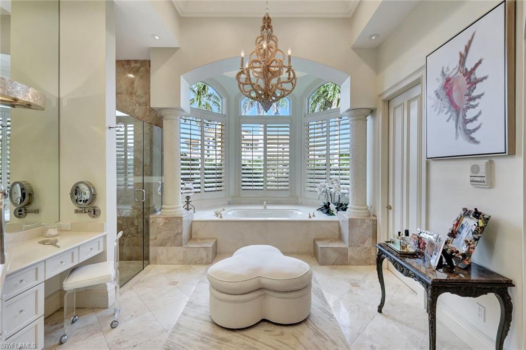 7261 Tilden Lane Naples, FL 34108 - Photo 30 of 46 a living room with furniture and a large window