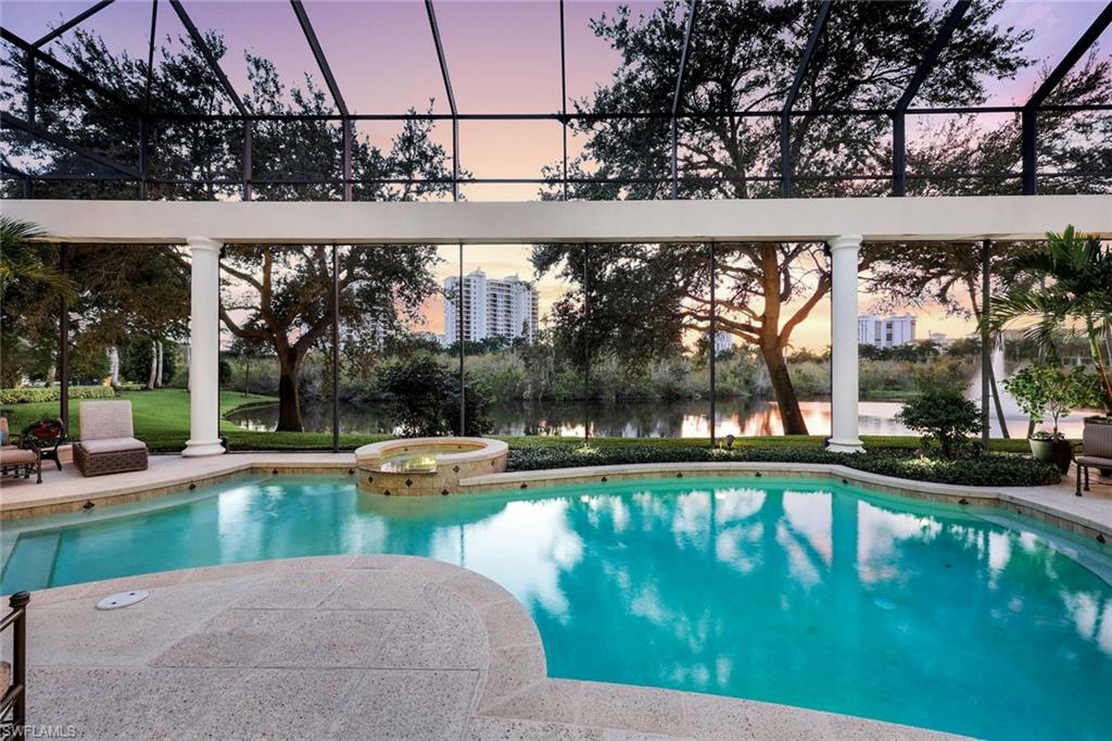 7261 Tilden Lane Naples, FL 34108 - Photo 3 of 46 a view of swimming pool with a yard