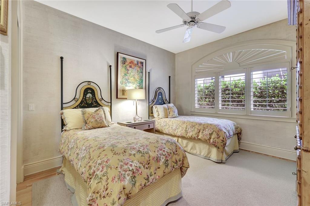 7261 Tilden Lane Naples, FL 34108 - Photo 37 of 46 a bedroom with two beds and large windows