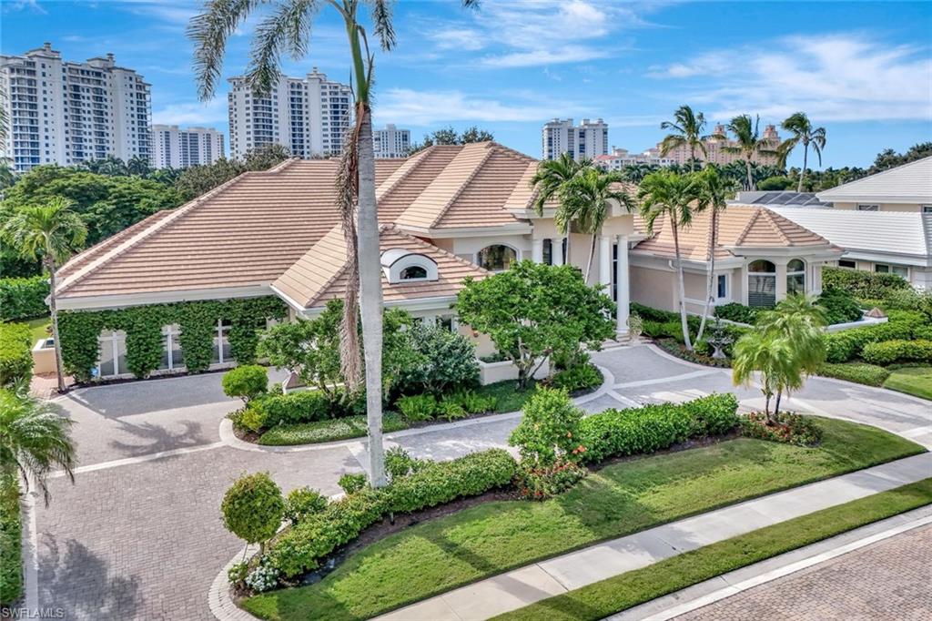 7261 Tilden Lane Naples, FL 34108 - Photo 43 of 46 a front view of a house with a yard