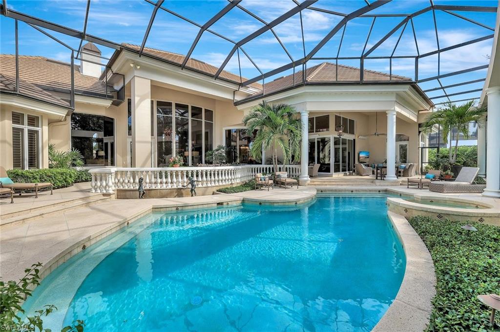 7261 Tilden Lane Naples, FL 34108 - Photo 6 of 46 a view of a swimming pool with potted plants