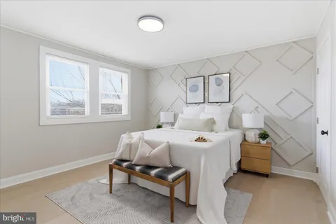 a bed room with a bed and a window