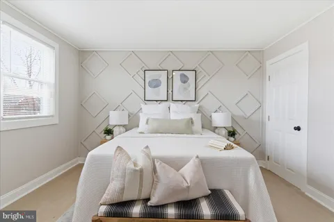 a bed room with a bed and a night stand