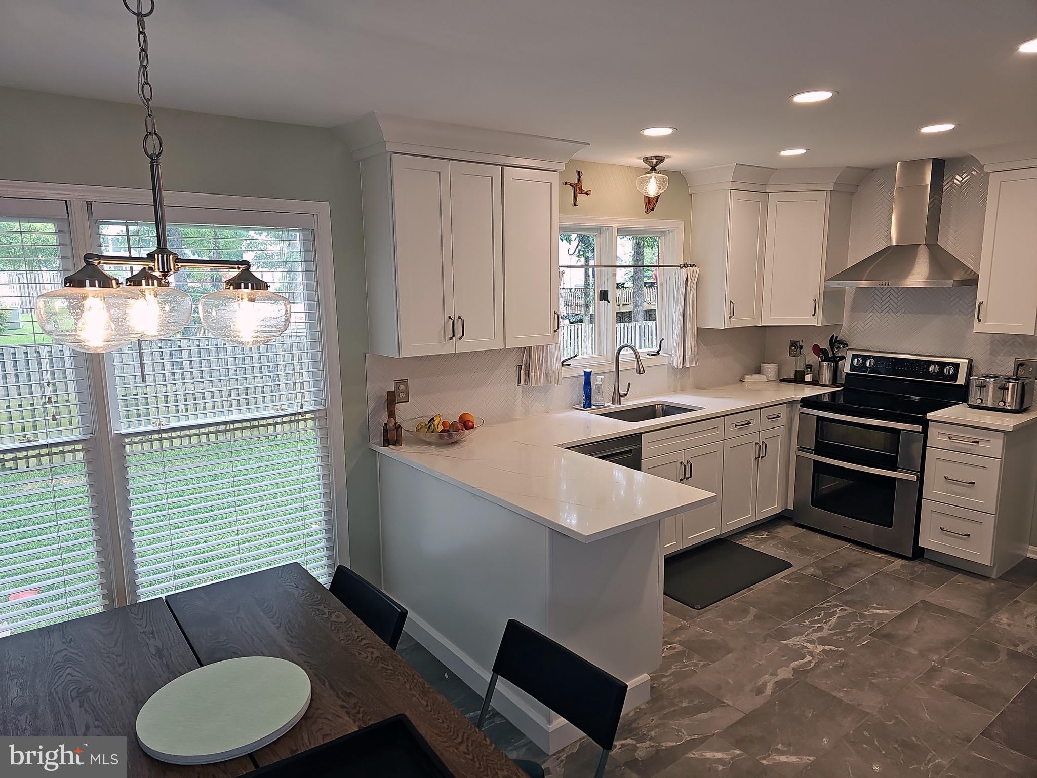 13903 Wild Raspberry Court Gainesville, VA 20155 - Photo 11 of 64 2023 new Kitchen, quartz counters, cabinets, floor