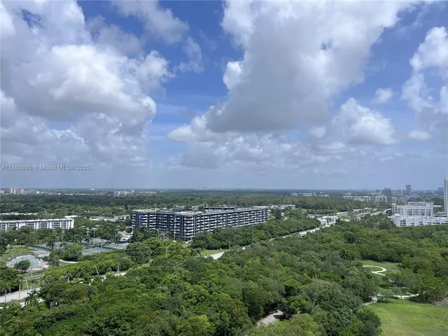 a view of a city with lots of trees
