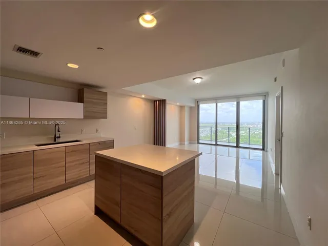 a kitchen with a stove and a sink