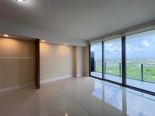 wooden floor in an empty room with windows