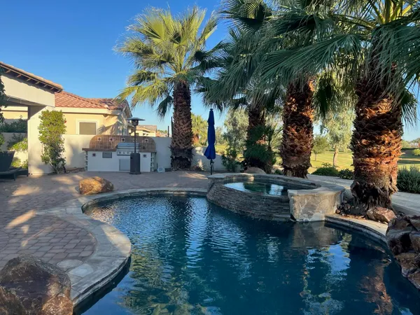 a view of a swimming pool with a patio