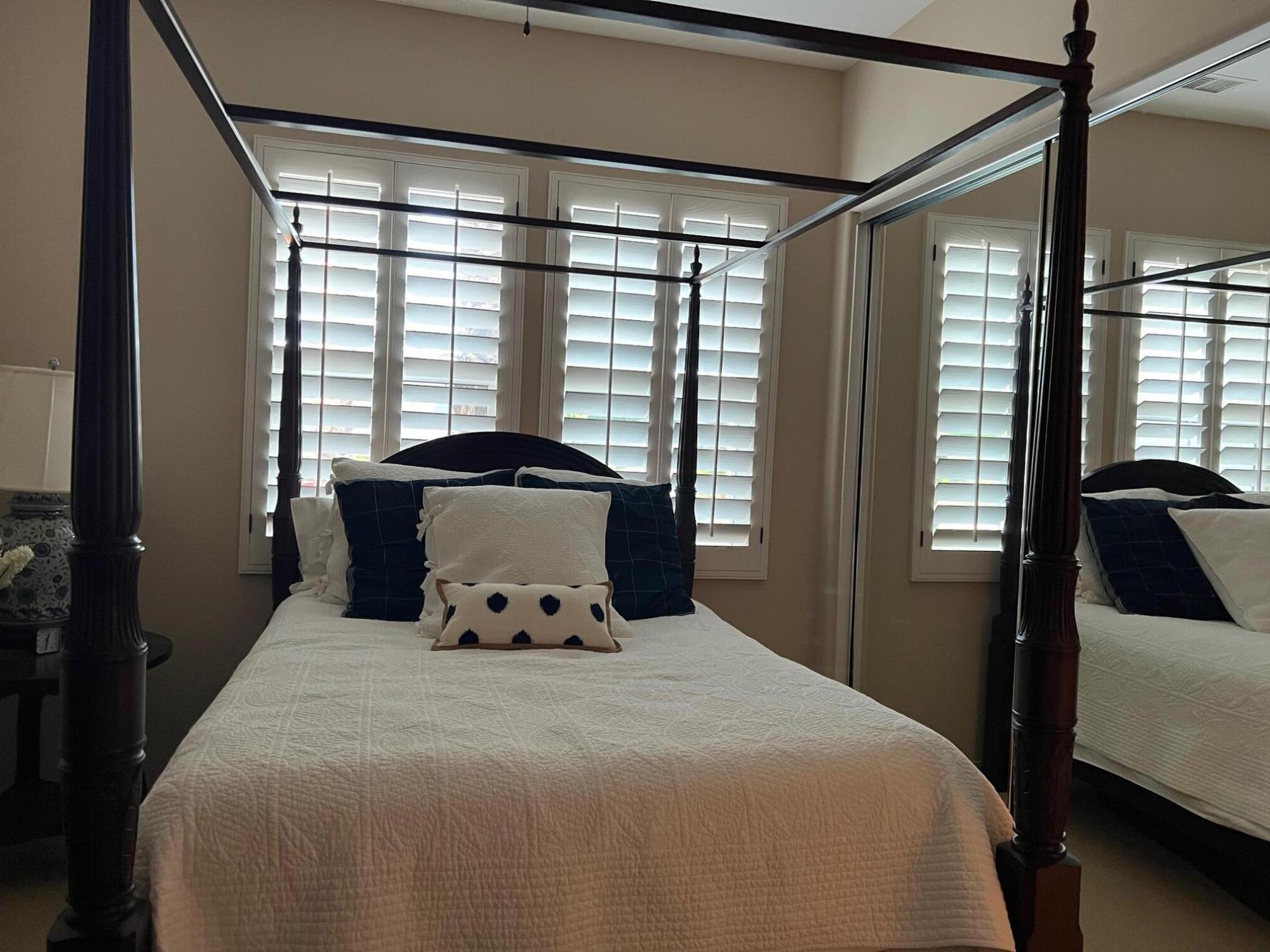 81373 Rustic Canyon Drive La Quinta, CA 92253 - Photo 17 of 61 a bedroom with a large bed and a large window