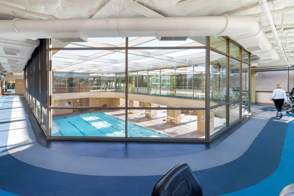 a front view of a building with a garden