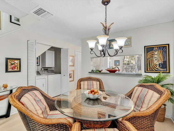 a living room with furniture a table and chairs