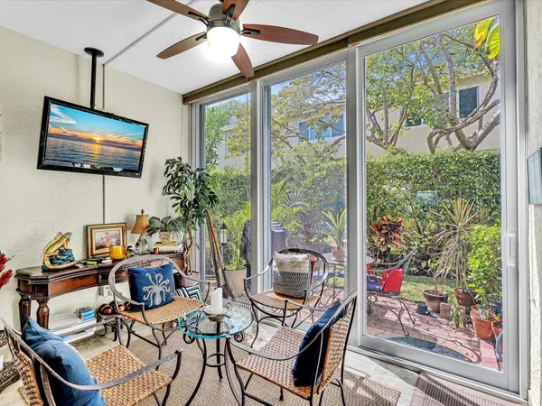 a work room with furniture and flat screen tv