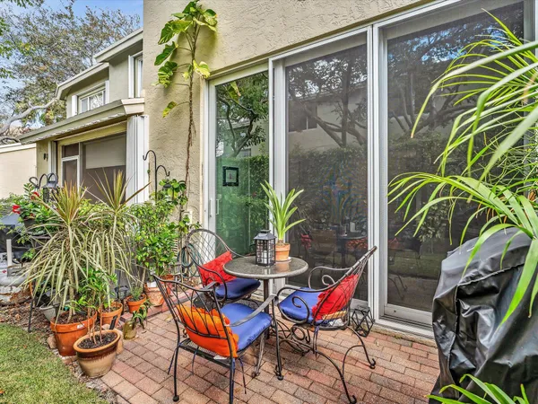 a backyard of a house with outdoor seating
