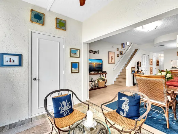 a living room with furniture and a chair