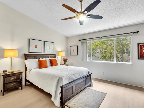 a bed room with a bed and a chandelier
