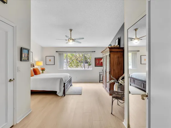 a bedroom with furniture and a window